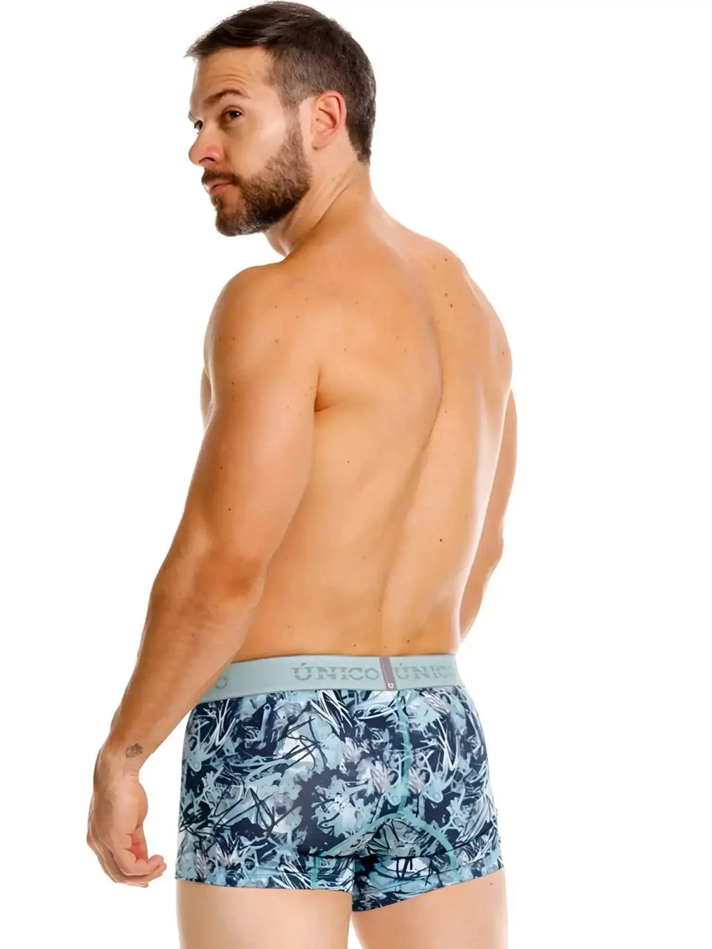 Unico Tags trunks in blue, back view on a male model.