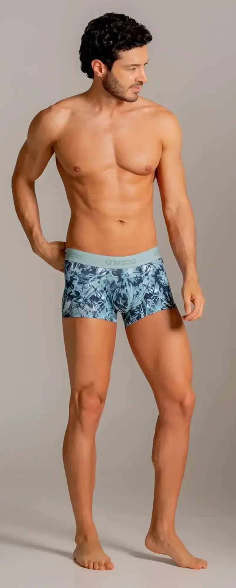 Unico 26040100112 Trunks in Blue. Front view of a model wearing the patterned underwear.