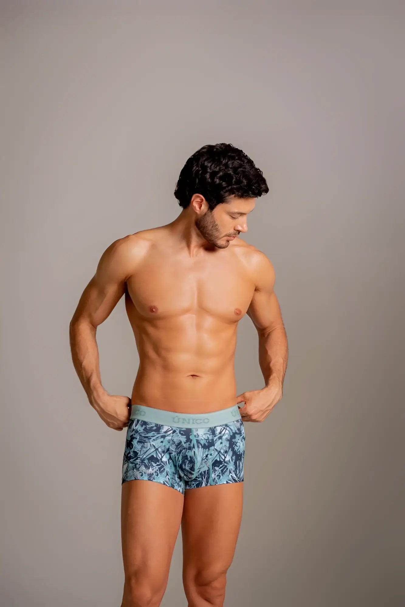 Unico Tags Trunks in Blue, modeled in a lifestyle shot.