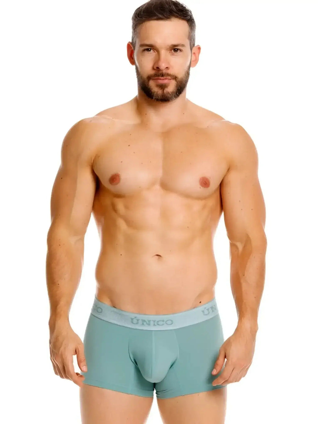 Front view of Unico 26040100121 Ceramic trunks in 43-Green worn by a male model.
