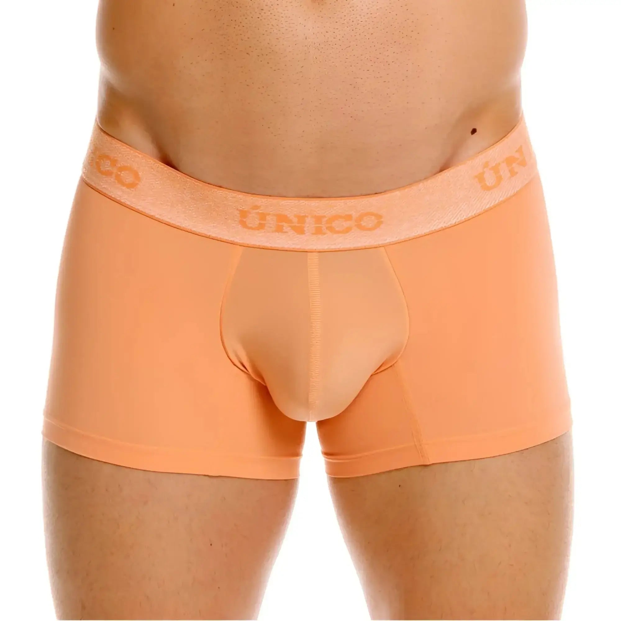 Front view of Unico Classic Trunks in apricot color on a model.