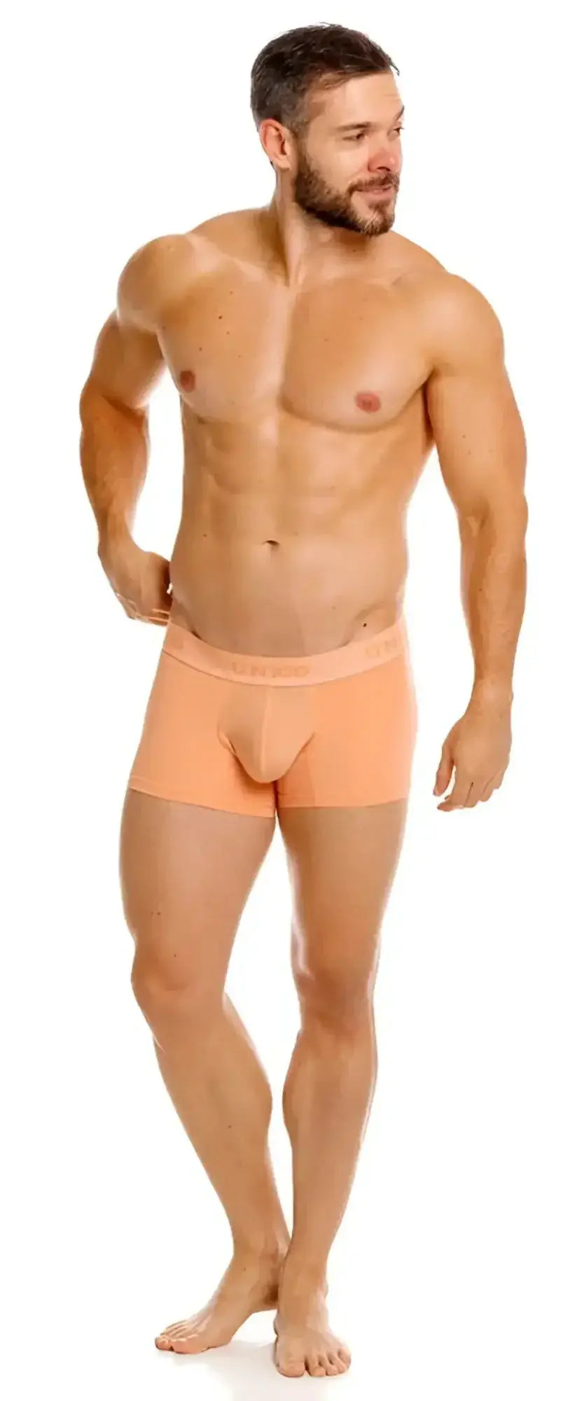 Unico Classic Trunks in apricot color, front view on a male model.