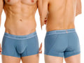 Unico Classic Trunks in blue, shown from front and back views on a model.