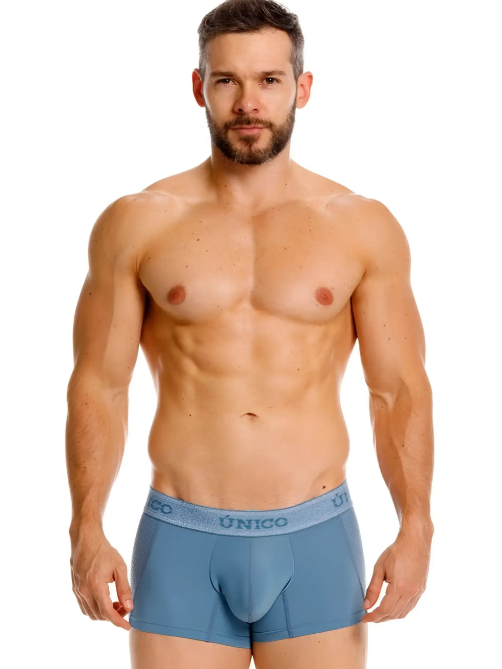 Front view of model wearing Unico Classic Trunks in 46-Blue.
