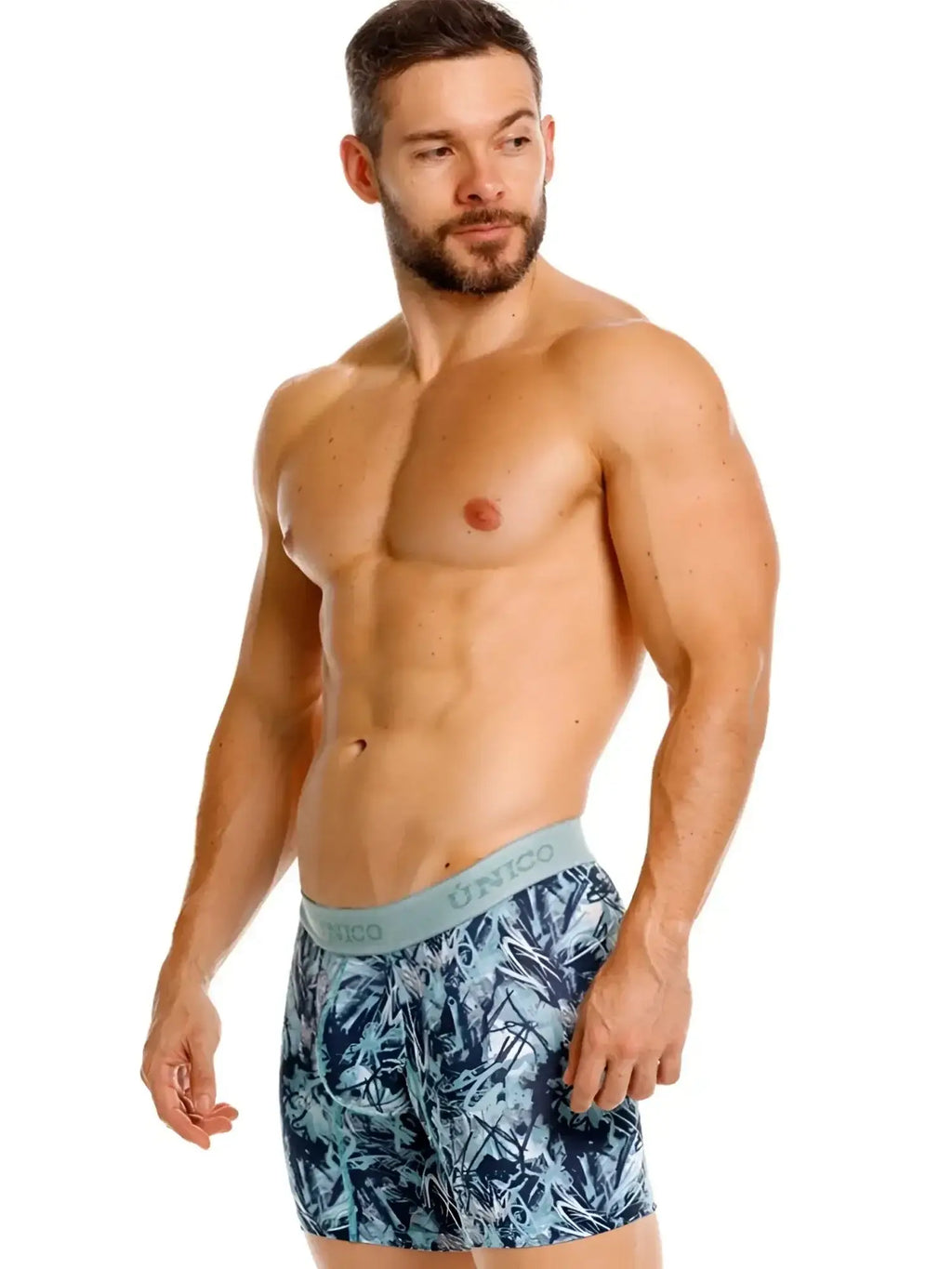 Unico Tags Boxer Briefs in blue, modeled in a studio lifestyle shot.