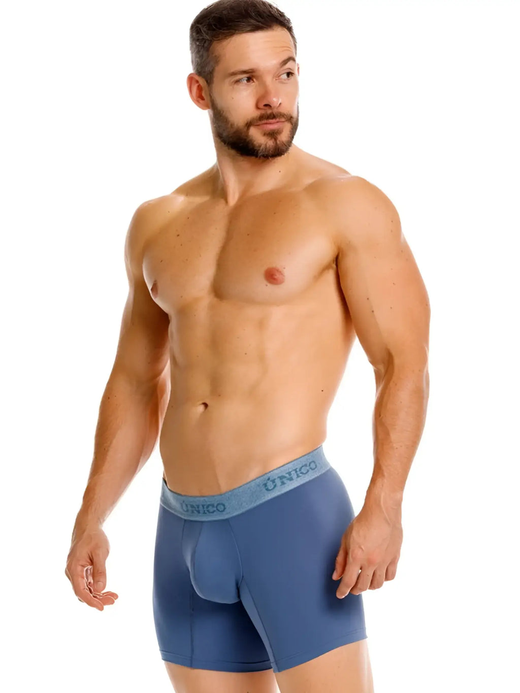 Unico Classic Boxer Briefs in Teal. Model wearing teal boxer briefs, front view, studio shot.