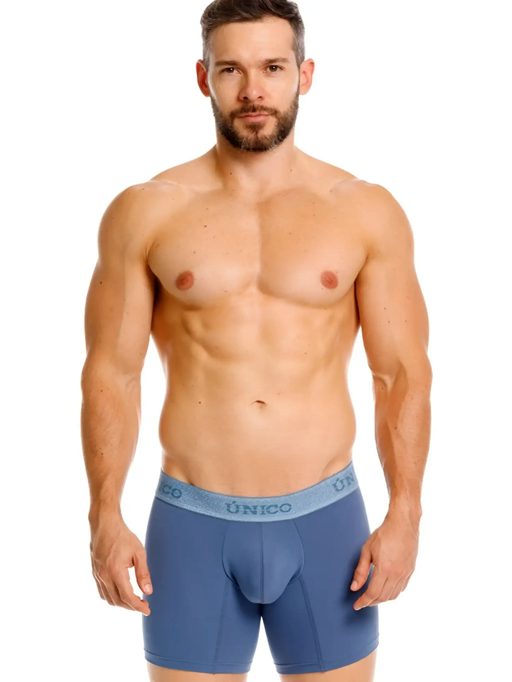Front view of a model wearing Unico Classic Boxer Briefs in teal.