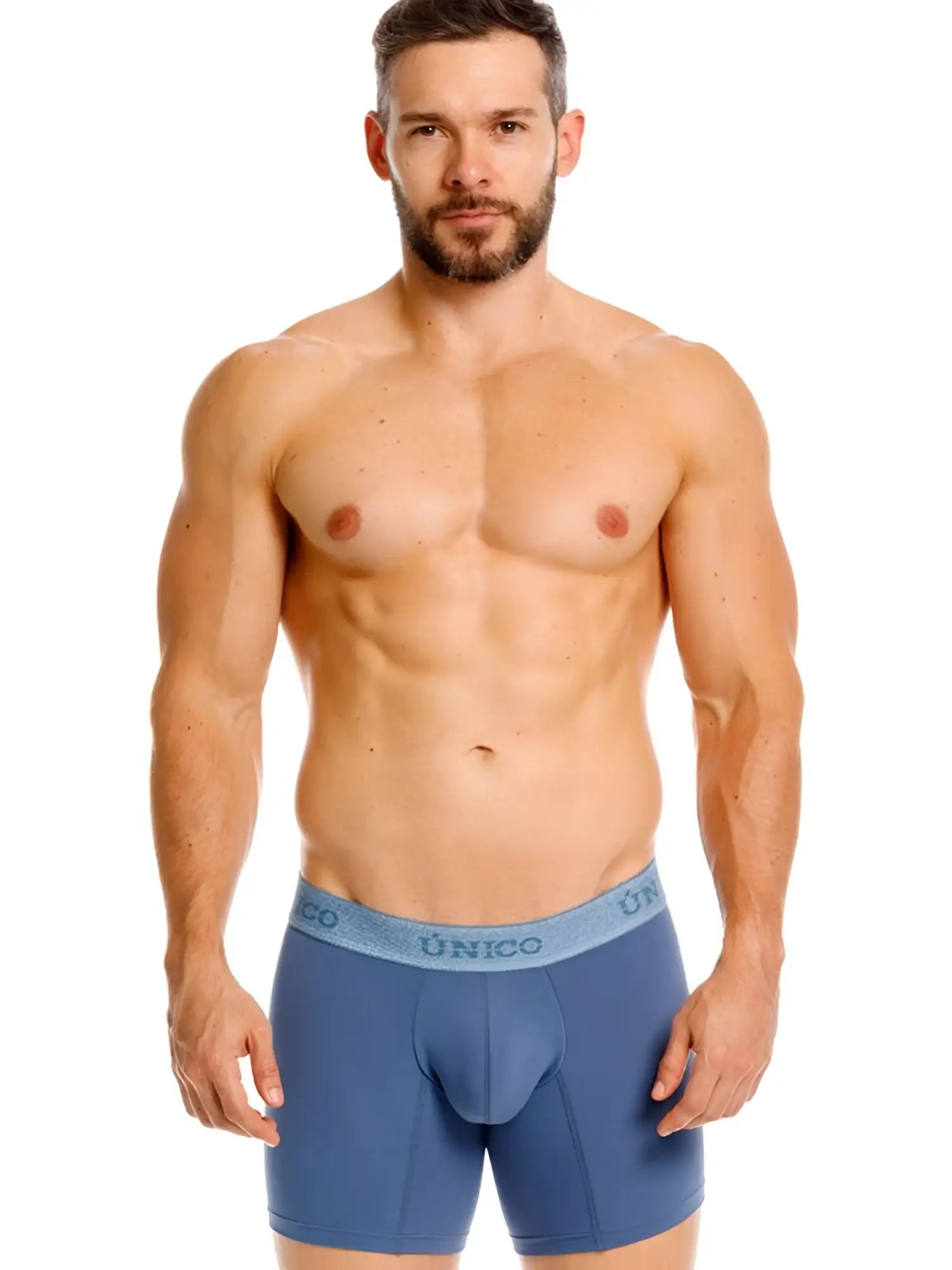 Front view of a model wearing Unico Classic Boxer Briefs in teal.