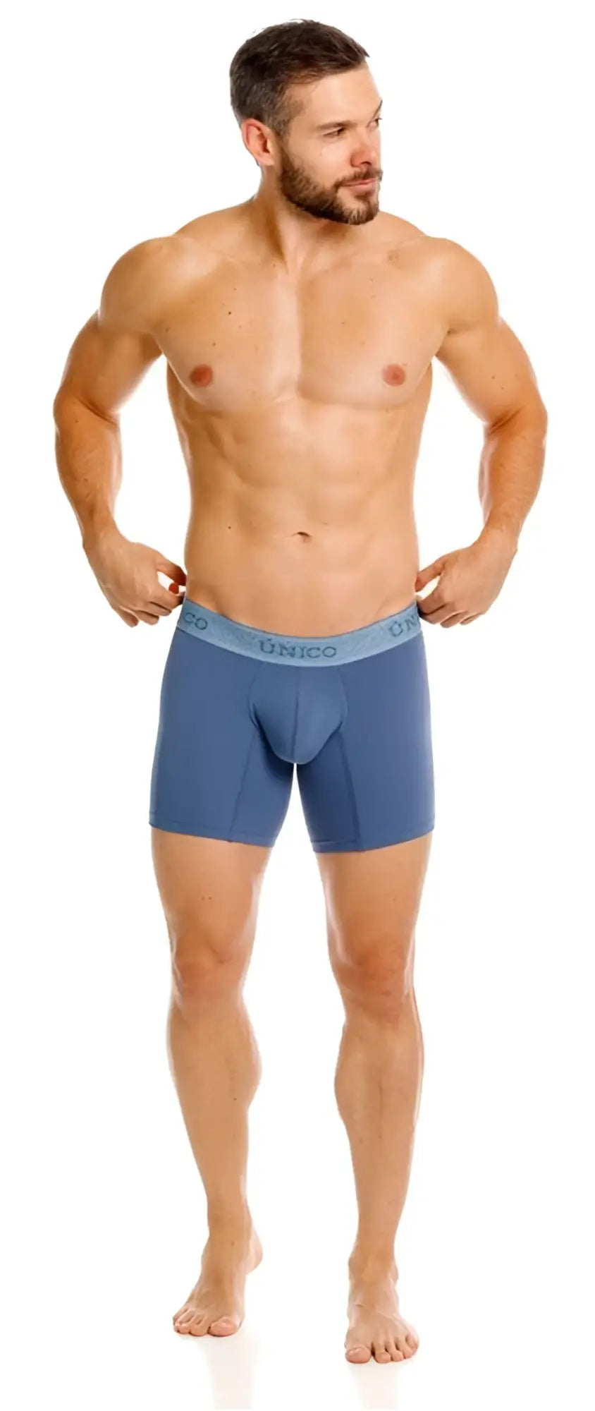 Front view of a model wearing Unico Classic Boxer Briefs in teal.