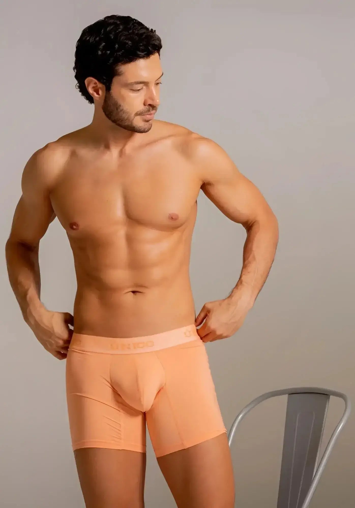Unico Classic boxer briefs in apricot, front view lifestyle shot featuring a model.