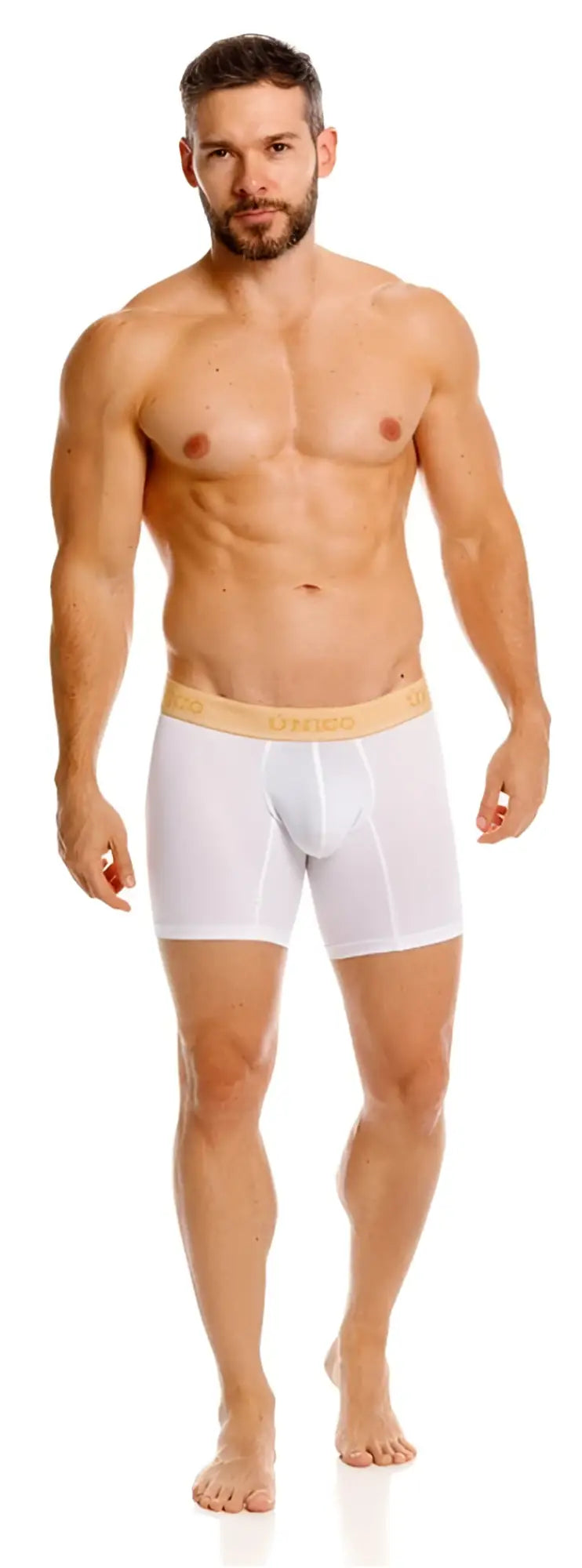 Front view of a model wearing Unico Amber white boxer briefs with a tan branded waistband.