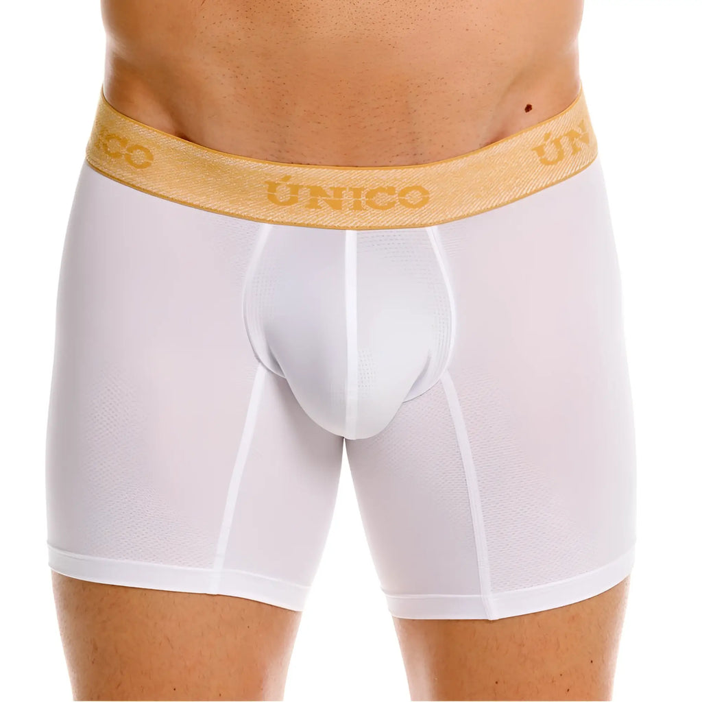 Front view of white Unico Amber boxer briefs with a gold branded waistband on a male model.