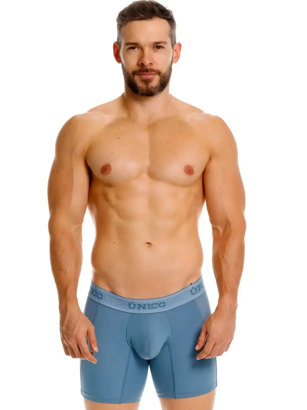 Front view of a man wearing blue Unico 26040100227 Classic Boxer Briefs.