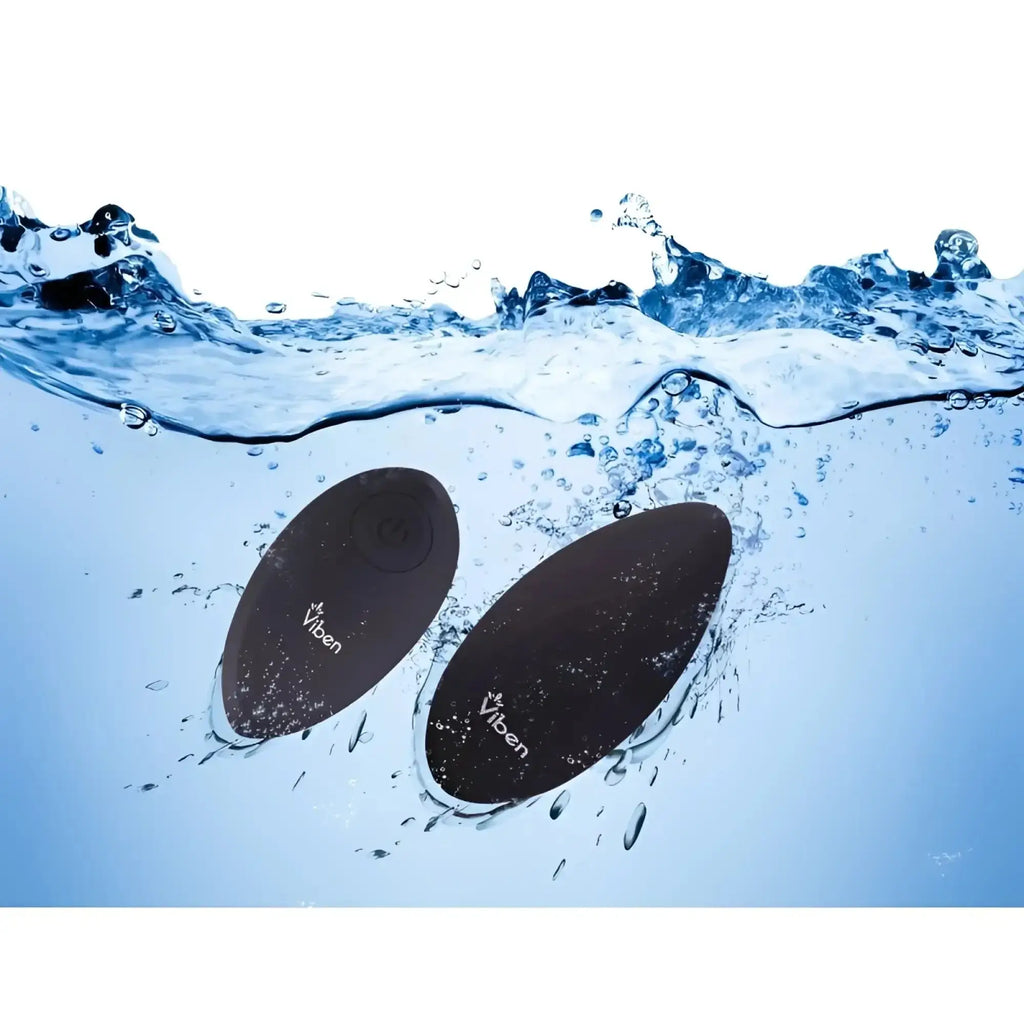 Black oval-shaped waterproof viben vibe floating in water from viben racy multi function panty vibe with remote