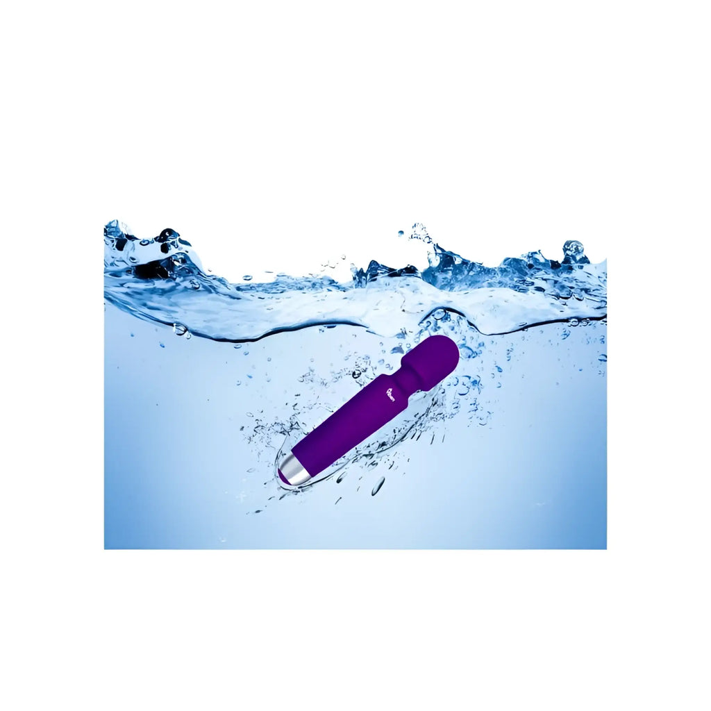 Viben tempest travel wand massager violet purple vibrating wand with silver metallic tip partially submerged in clear water