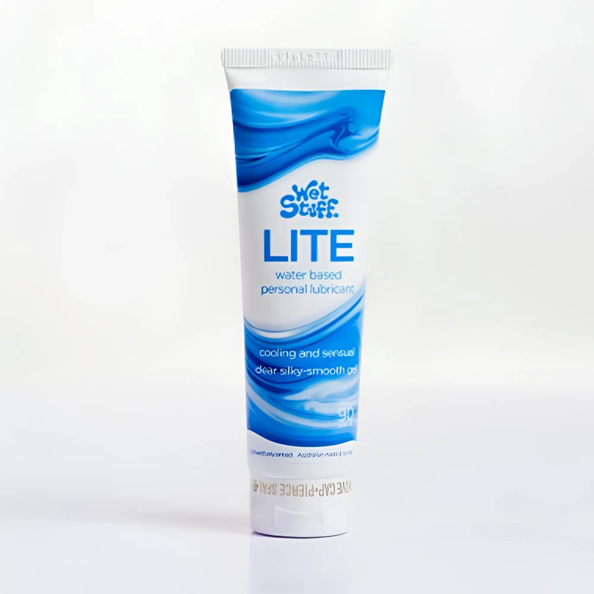 A white and blue tube of wet stuff lite 90g water-based personal lubricant with a sleek wave-patterned design
