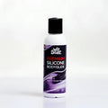A white bottle with black cap and purple label of Wet Stuff premium silicone bodyglide disc top 125g product
