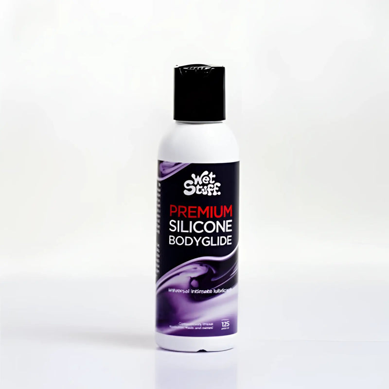 A white bottle with black cap and purple label of Wet Stuff premium silicone bodyglide disc top 125g product