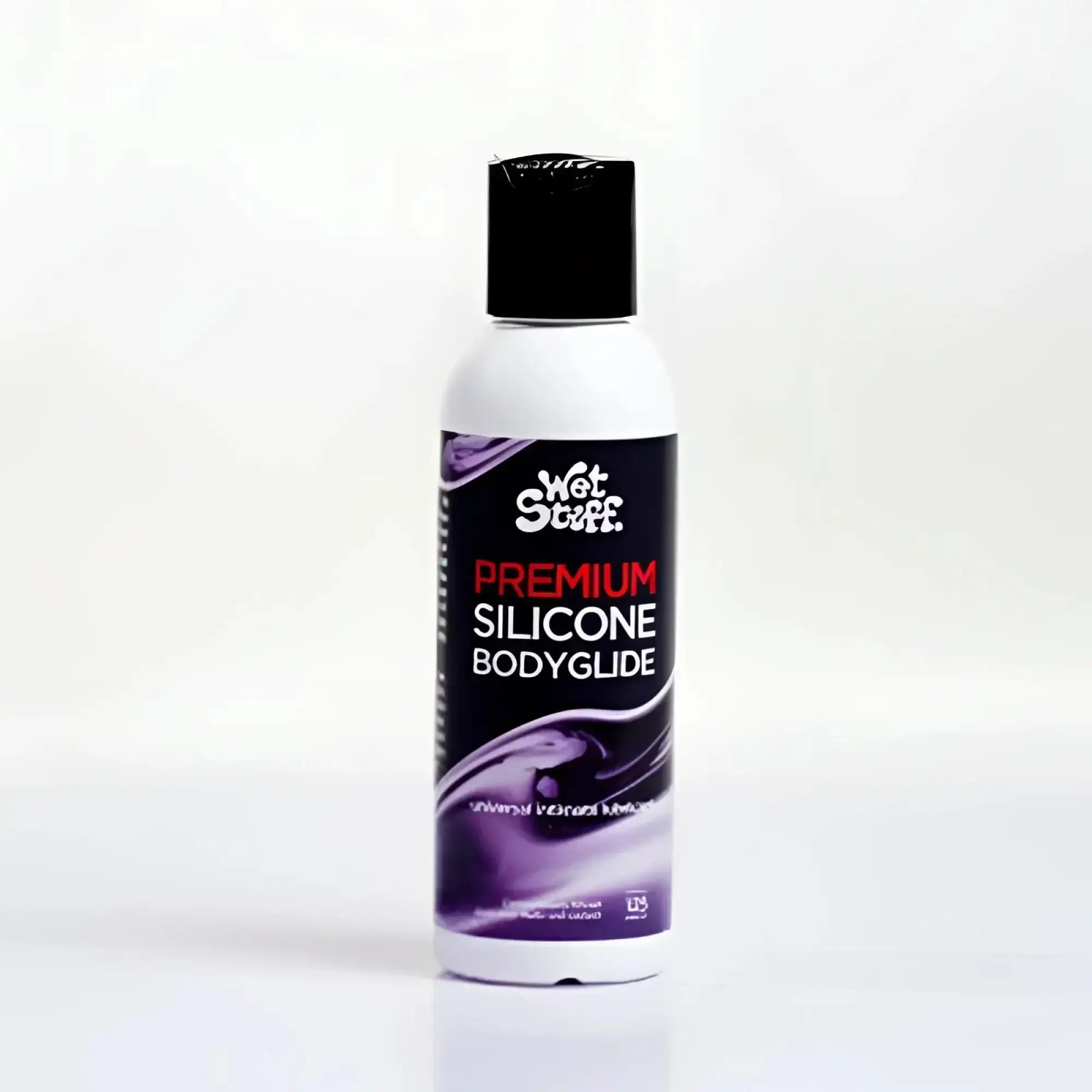 A white bottle with black cap and purple label of Wet Stuff premium silicone bodyglide disc top 50g