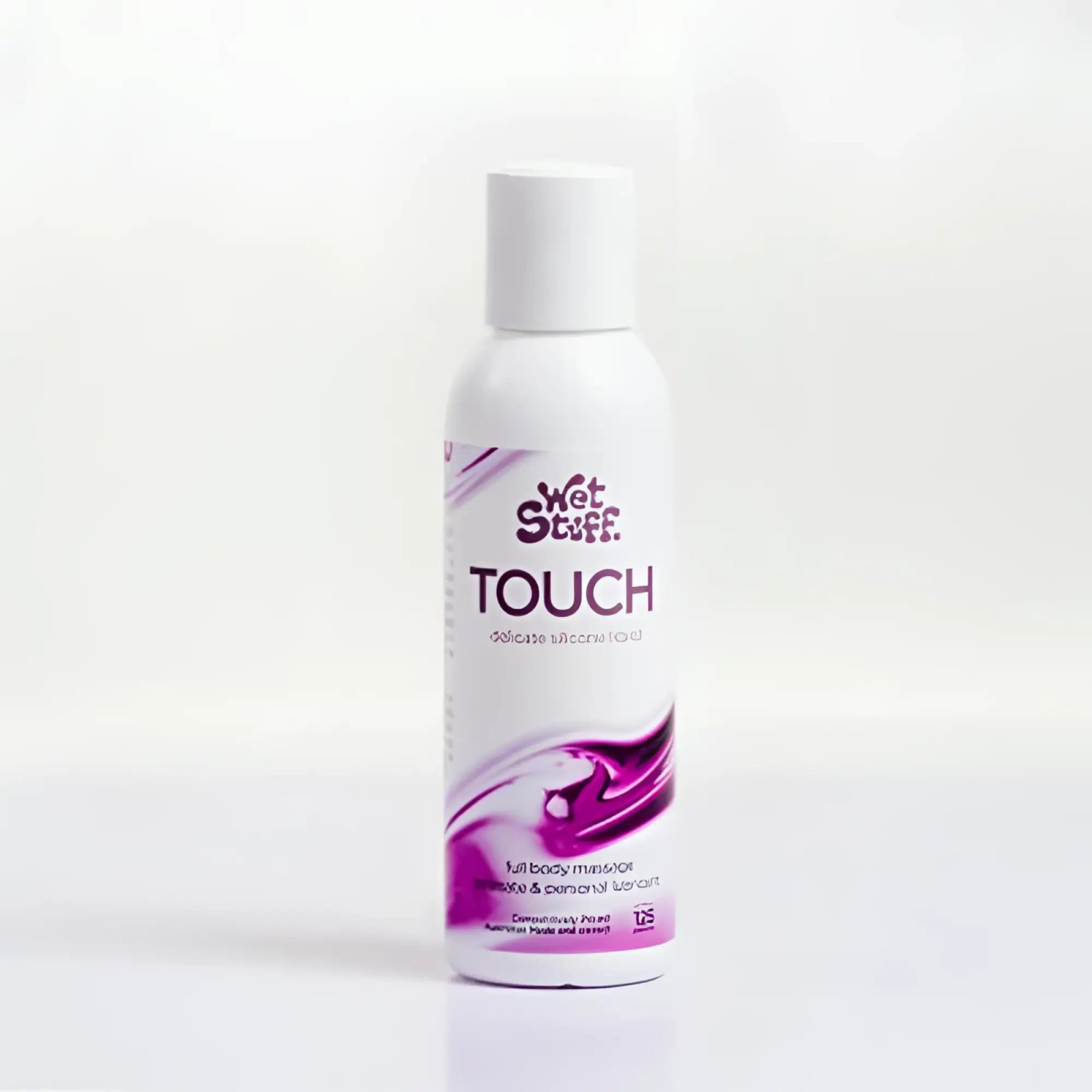White plastic bottle of wet stuff touch silicone-based lubricant with purple and white swirling label 125g