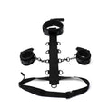 Black leather bondage set with decorative patterned cuffs and central strap from whipsmart whip smart diamond body restraint