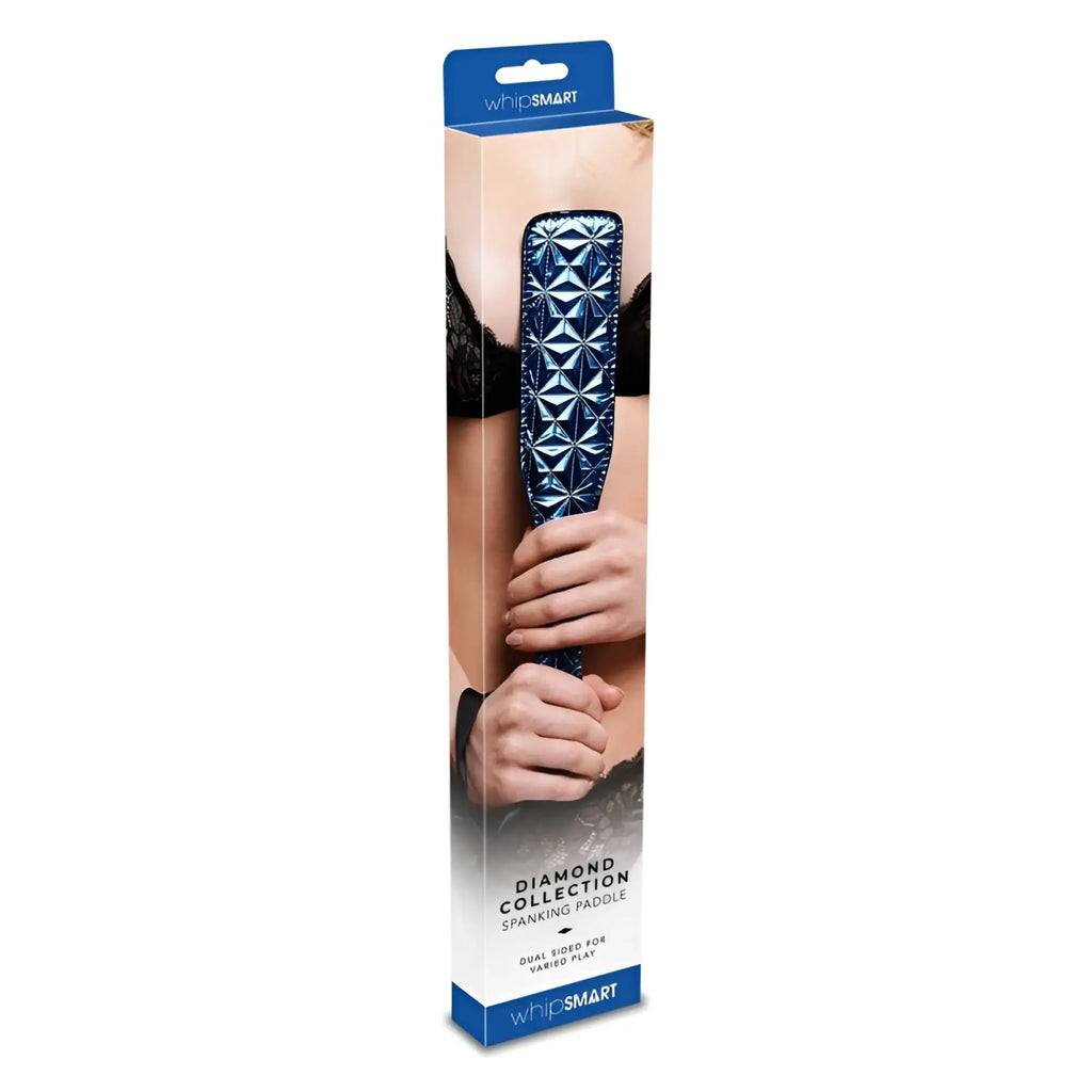 Blue diamond-patterned leather spanking paddle in retail packaging from whipsmart whip smart diamond paddle blue