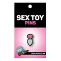 Wood Rocket gem butt plug enamel pin with pink glittery gem, silver metallic base, and black outline design