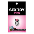 Wood Rocket gem butt plug enamel pin with pink glittery gem, silver metallic base, and black outline design