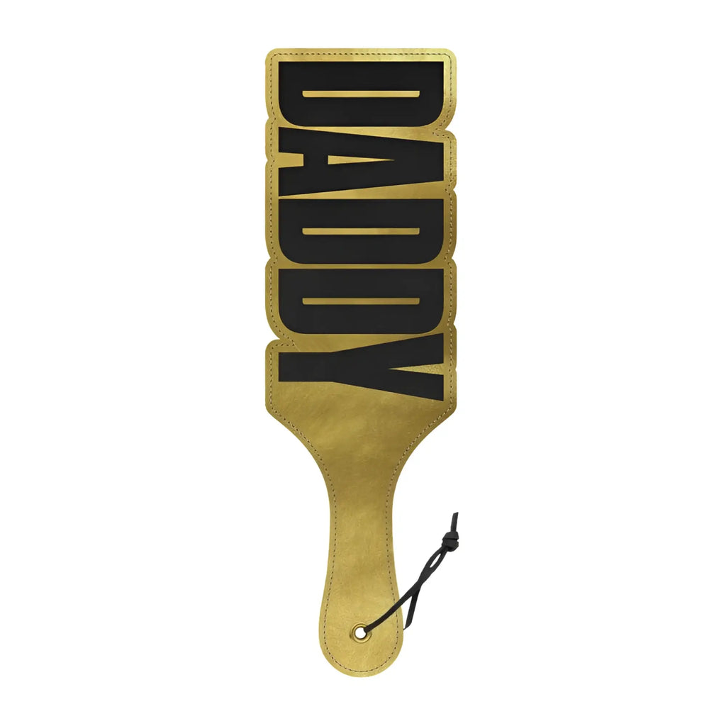 Gold-colored leather wood rocket paddle with black daddy lettering for decorative or functional use