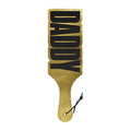 Gold-colored leather wood rocket paddle with black daddy lettering for decorative or functional use