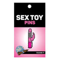 Wood rocket rabbit enamel pin featuring a pink textured rabbit-shaped design with silver accents
