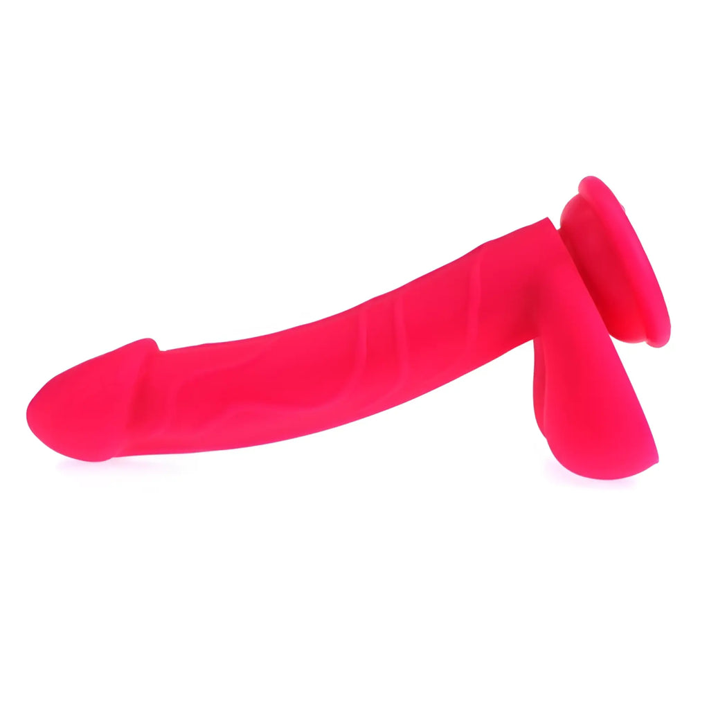 Bright pink silicone x-men realistic cock with balls featuring textured ridges and a flared base anal plug