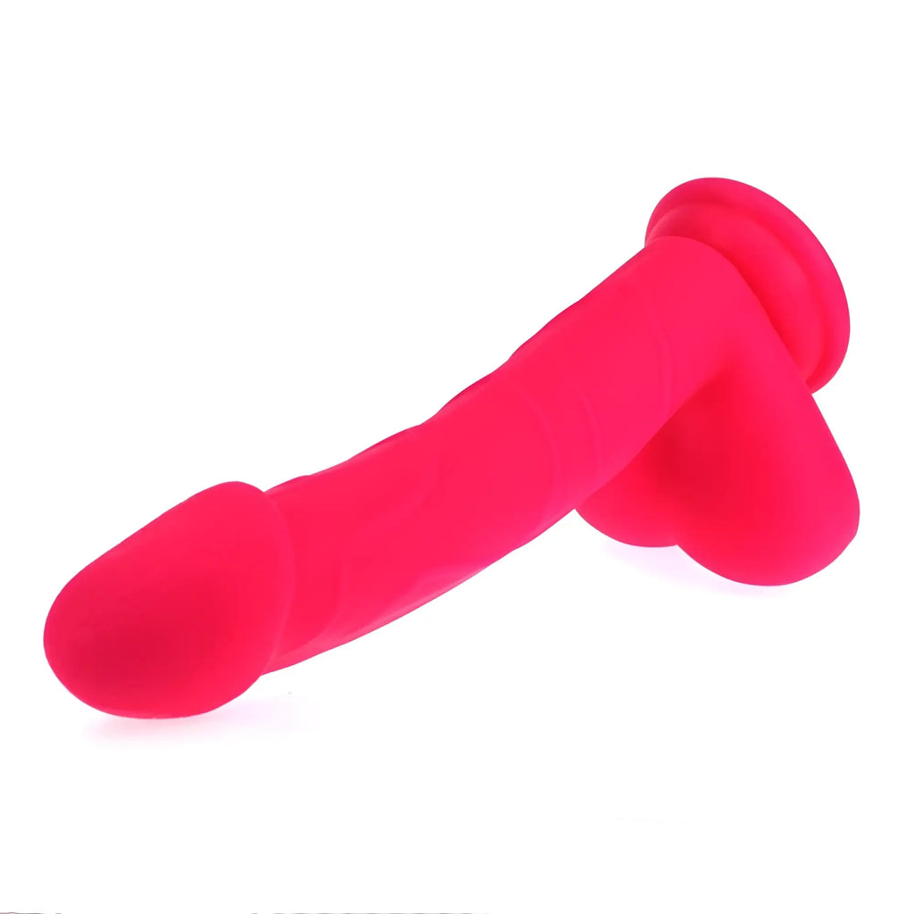 Bright pink silicone x-men realistic cock with balls featuring a rounded head and flared base for secure use