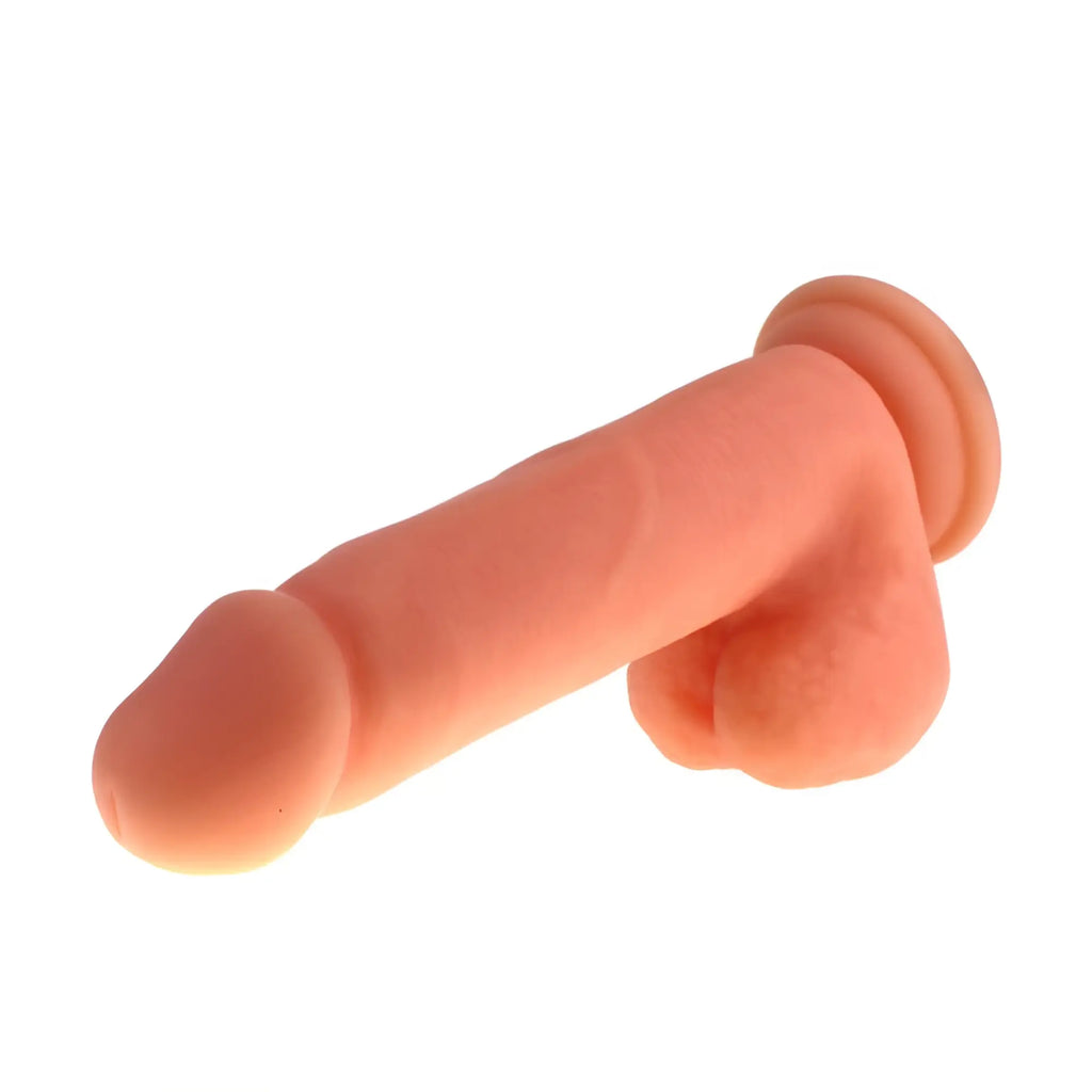 Peach-colored silicone realistic phallic toy with rounded head and bulbous base x-men thick cock with balls flesh