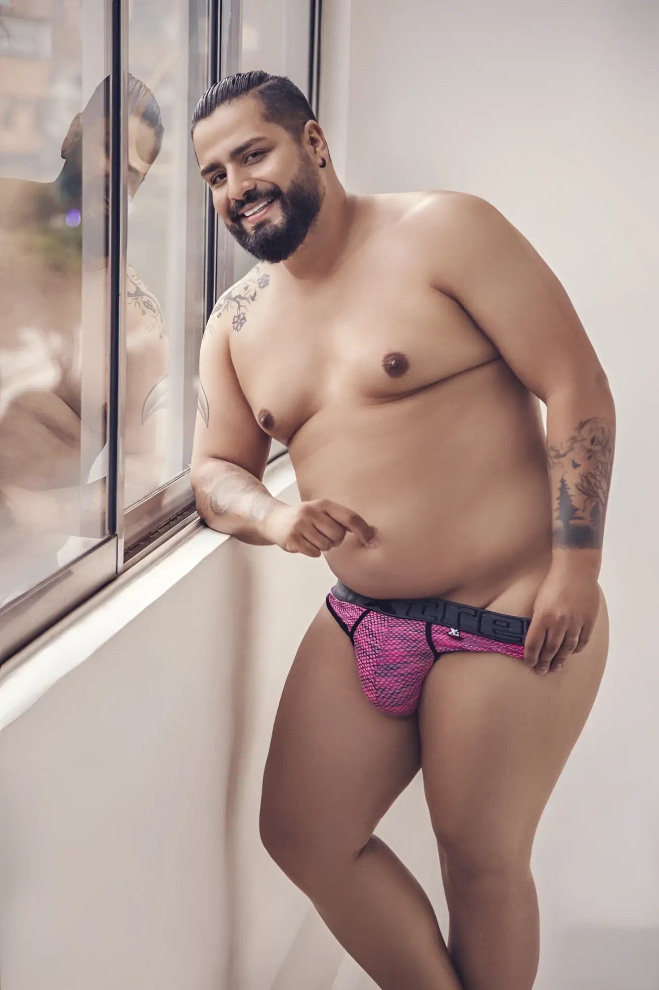 Pink xtremen 91100X microfiber mesh briefs with black trim and visible brand logo on the waistband