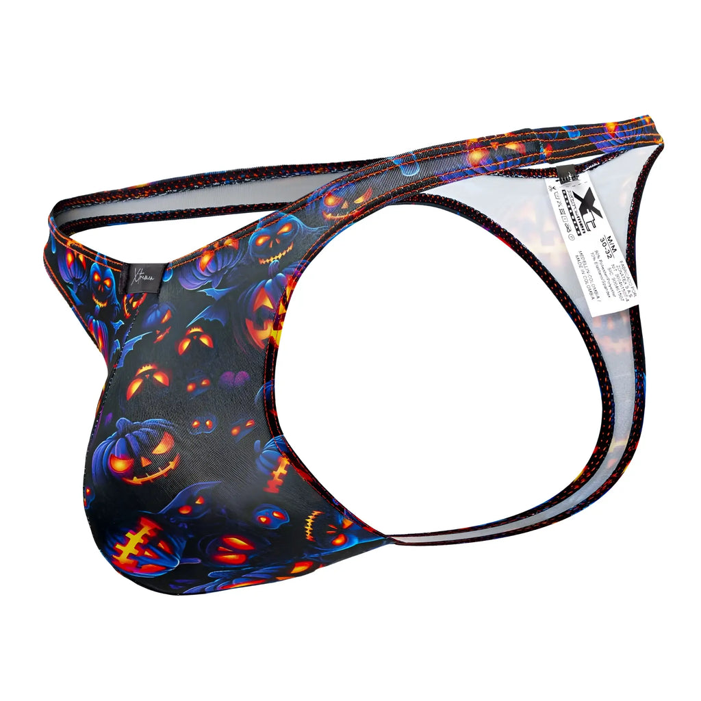 Black halloween-themed men’s thong xtremen 91194 with glowing orange pumpkins blue accents and back mesh panel shown from back