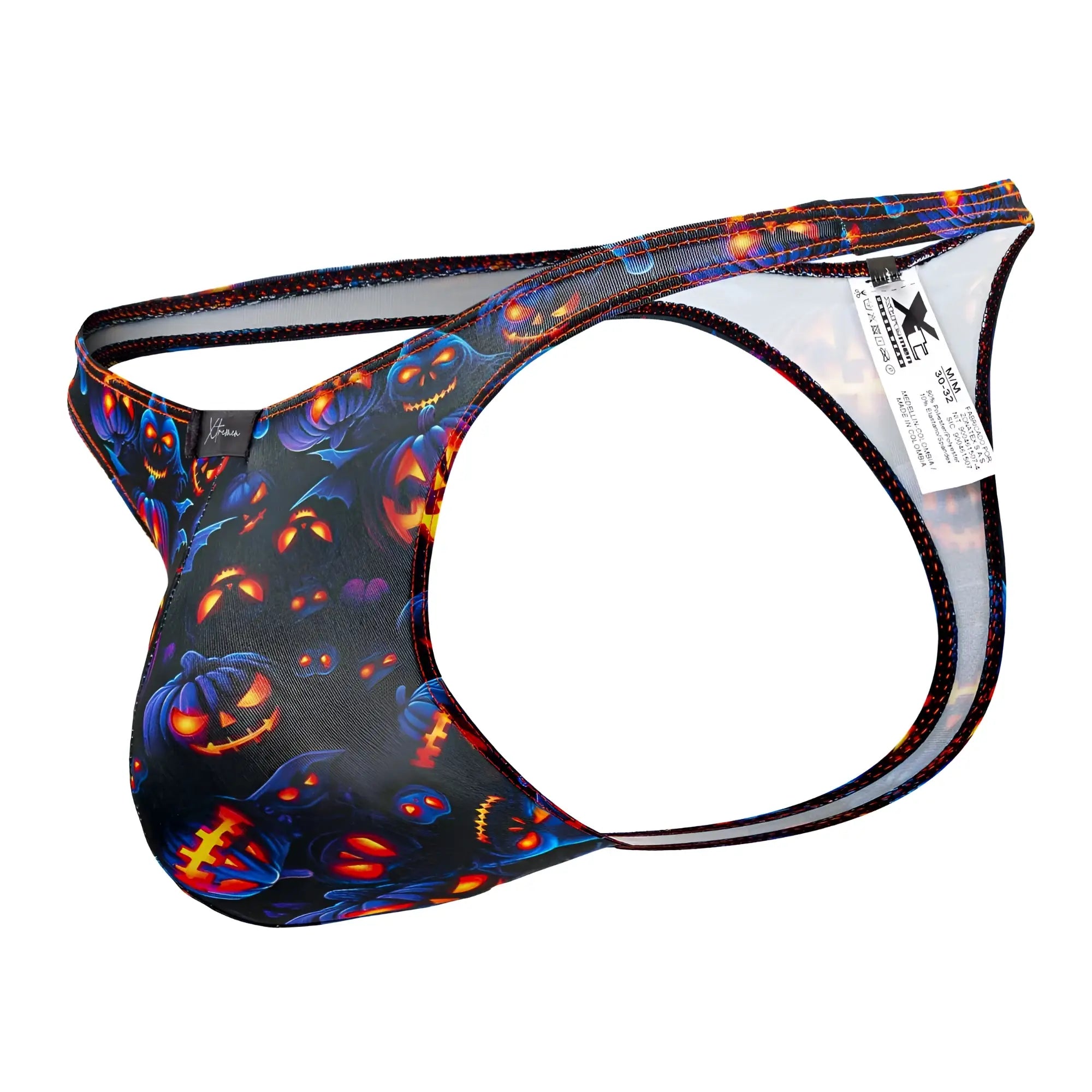 Black halloween-themed men’s thong xtremen 91194 with glowing orange pumpkins blue accents and back mesh panel shown from back