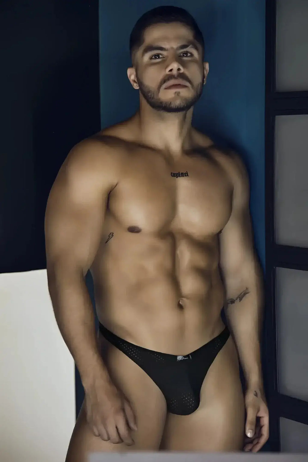 Black Xtremen 91214B microfiber thong briefs with breathable mesh and a subtle logo on the waistband