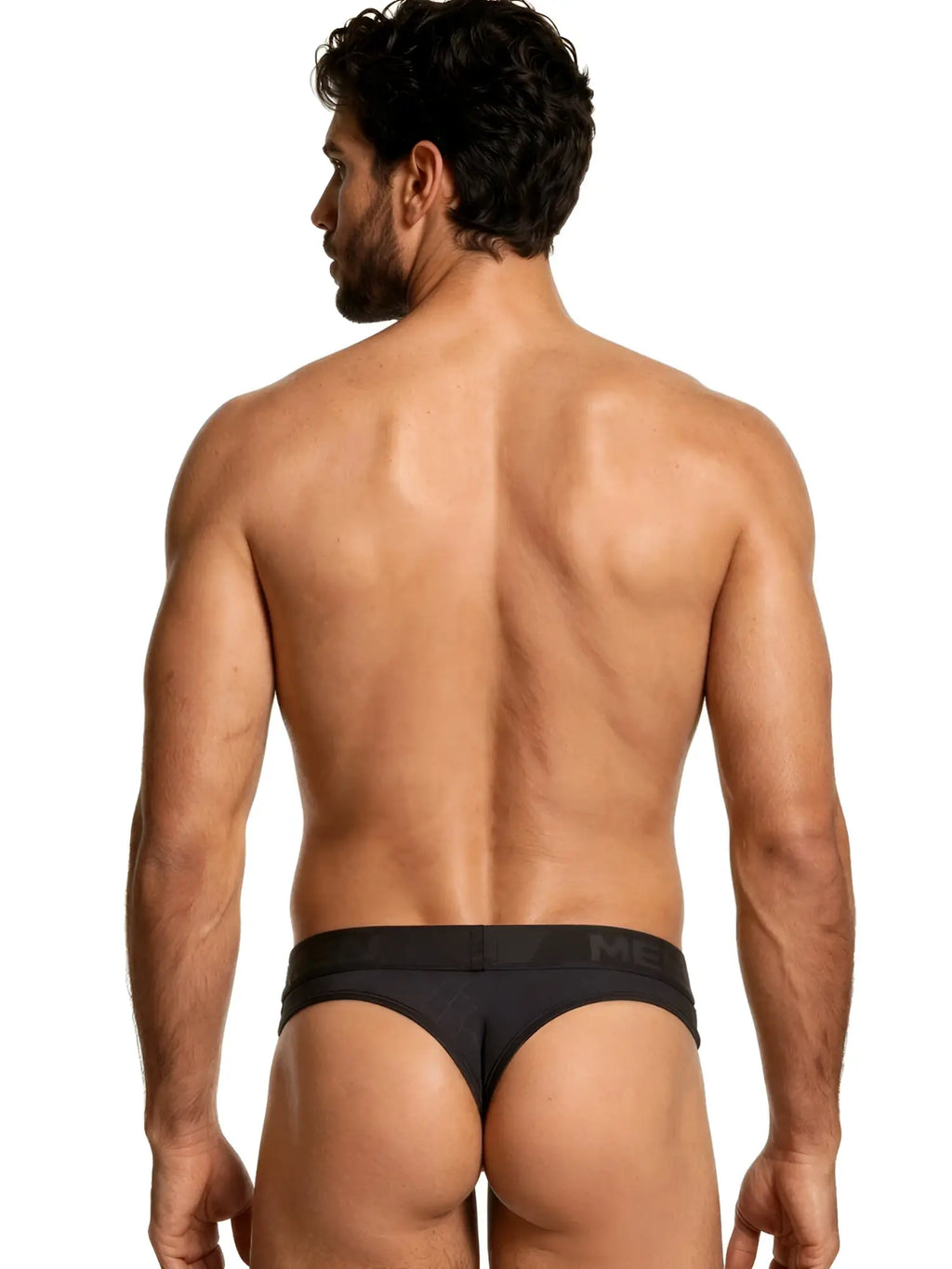 Xtremen black thong, style 76192, featuring a branded waistband and textured fabric detail. Rear view.