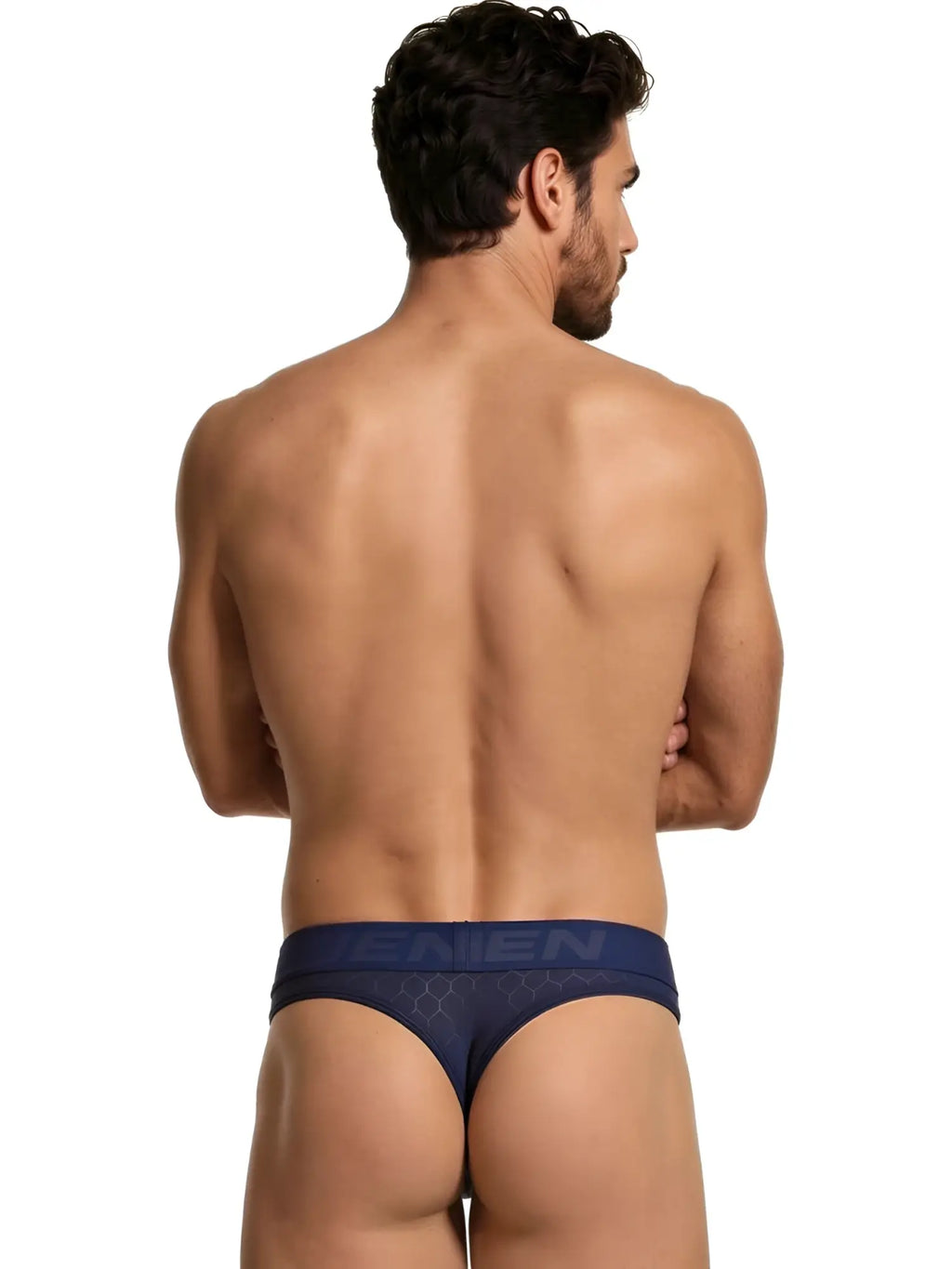 Xtremen thong in navy honeycomb-patterned microfibre with branded waistband. Rear view of model.