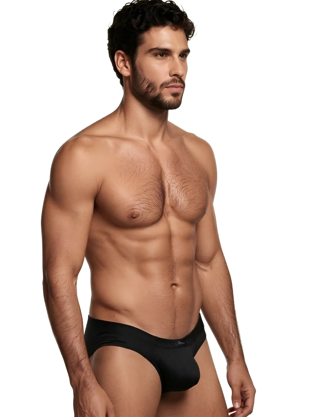 Xtremen men's black brief with a textured pattern. Model in classic fit underwear.