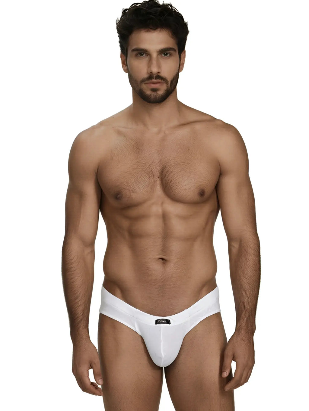 Xtremen white bikini brief with textured fabric. Model wearing slim-fit design with branded waist label.