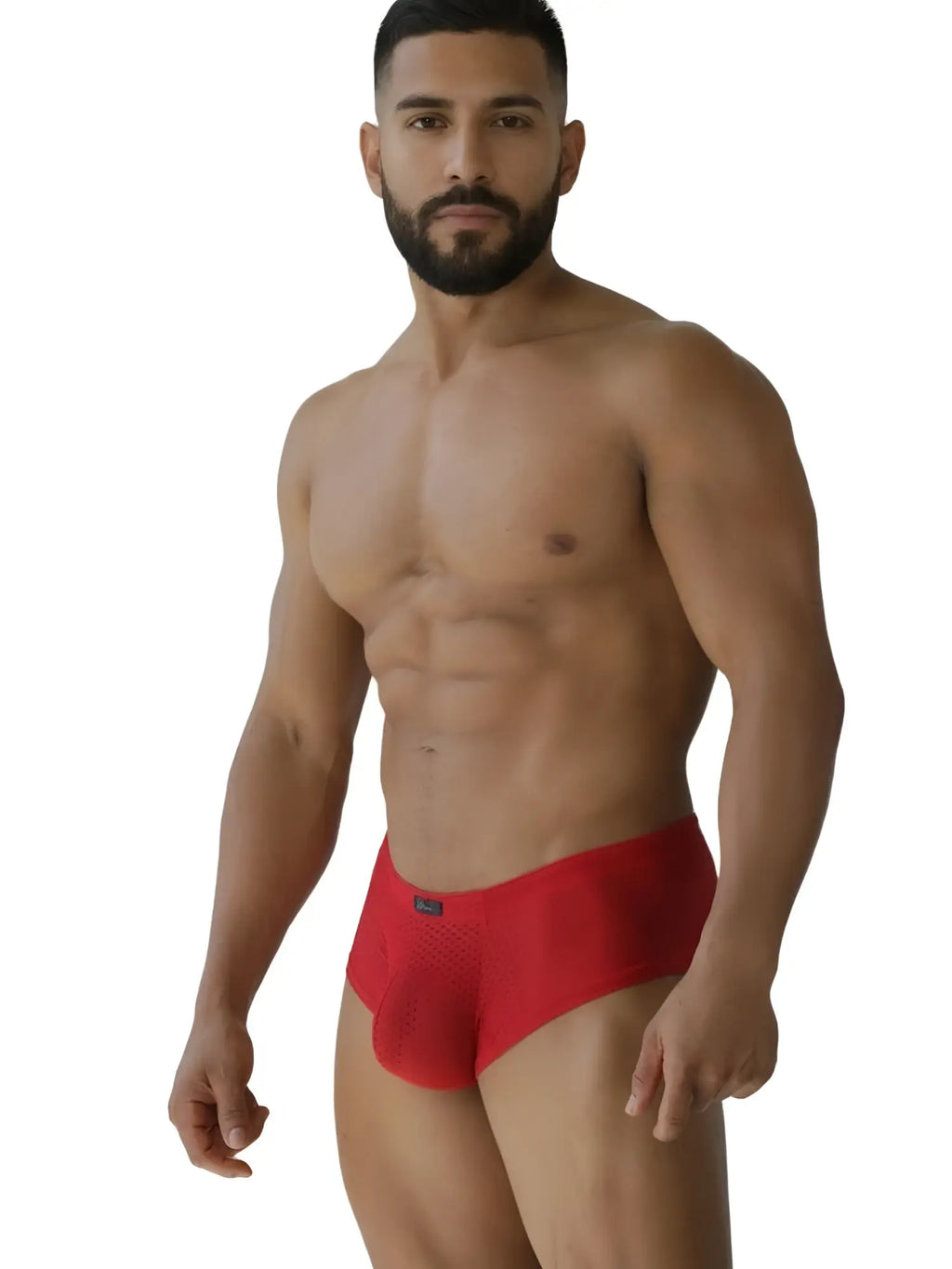 Man wearing red mesh low-rise briefs with a sporty, athletic fit.