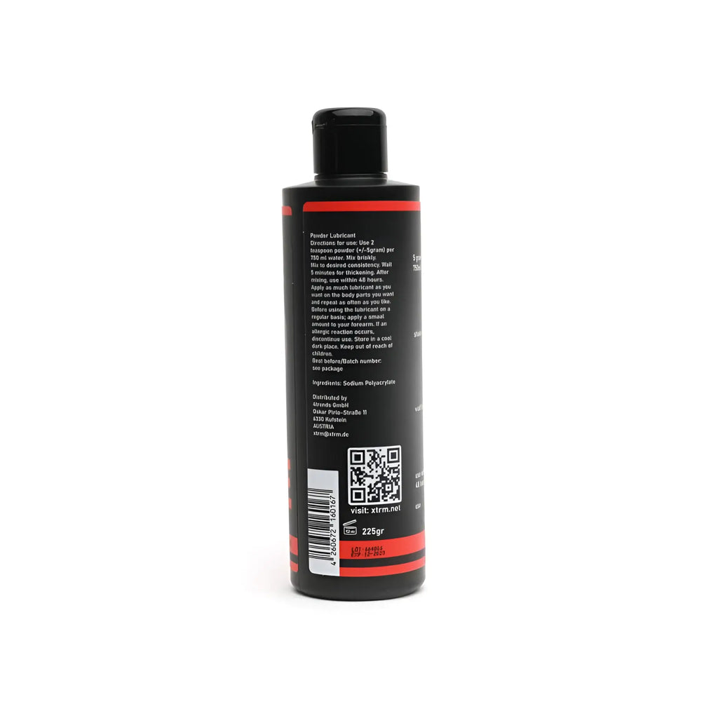 Black plastic bottle with red accents and black cap containing xtrm powder lubricant 225gm for 25 litres use