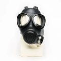 Black rubber gas mask with clear lenses and perforated filter housing from XTRM military adjustable strap design