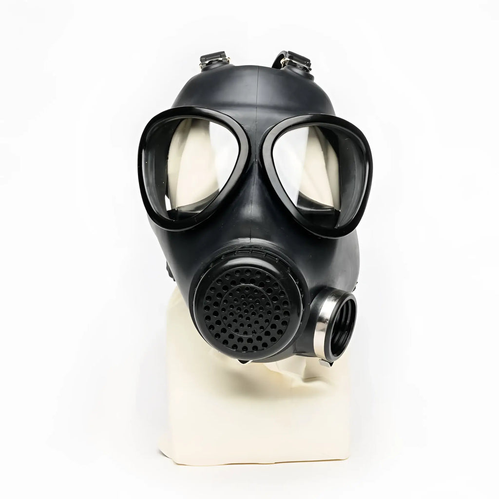 Black rubber gas mask with clear lenses and perforated filter housing from XTRM military adjustable strap design