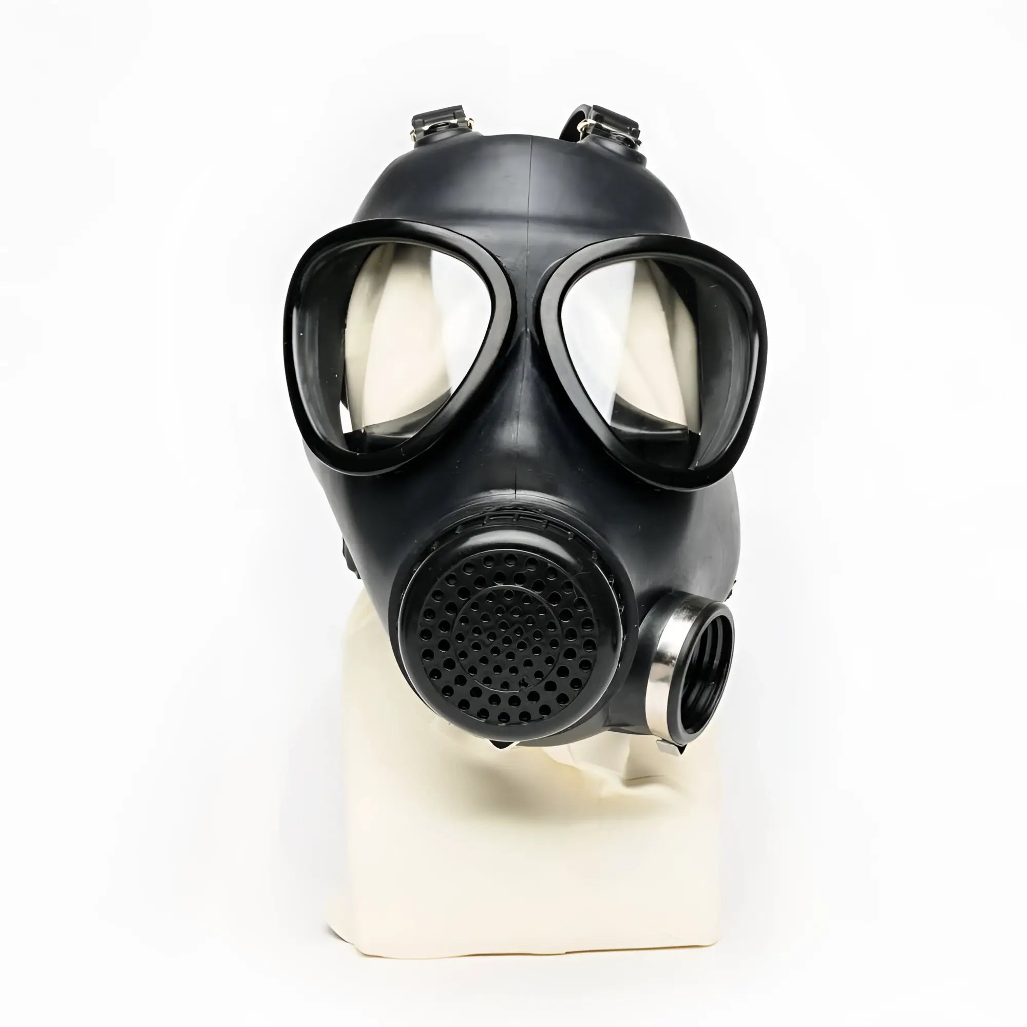 Black rubber gas mask with clear lenses and perforated filter housing from XTRM military adjustable strap design
