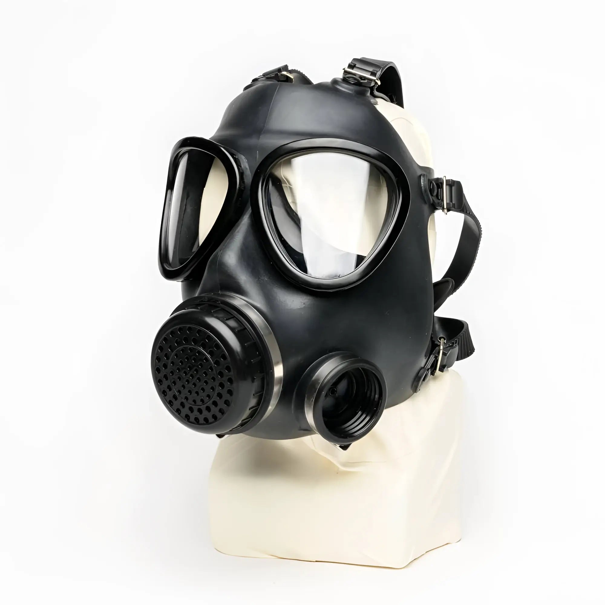 Black rubber XTRM military gas mask with clear lenses and perforated filter housing for adjustable strap fit