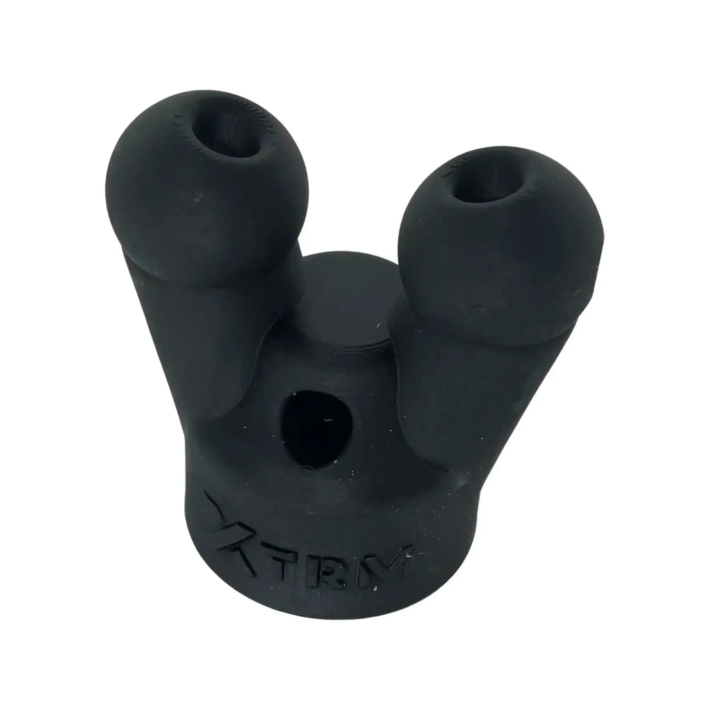 Black rubbery xtrm snffr double small mounting adapter with three prongs two rounded ends and central hole